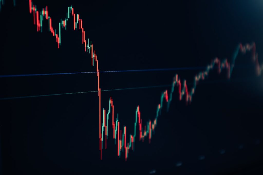 Candlestick market chart for NetNapz Academy support, resistance and trend guide. Photo by Austin Hervias via Unsplash.