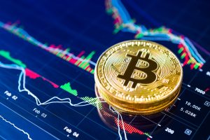 Bitcoin coins over a cryptocurrency market chart