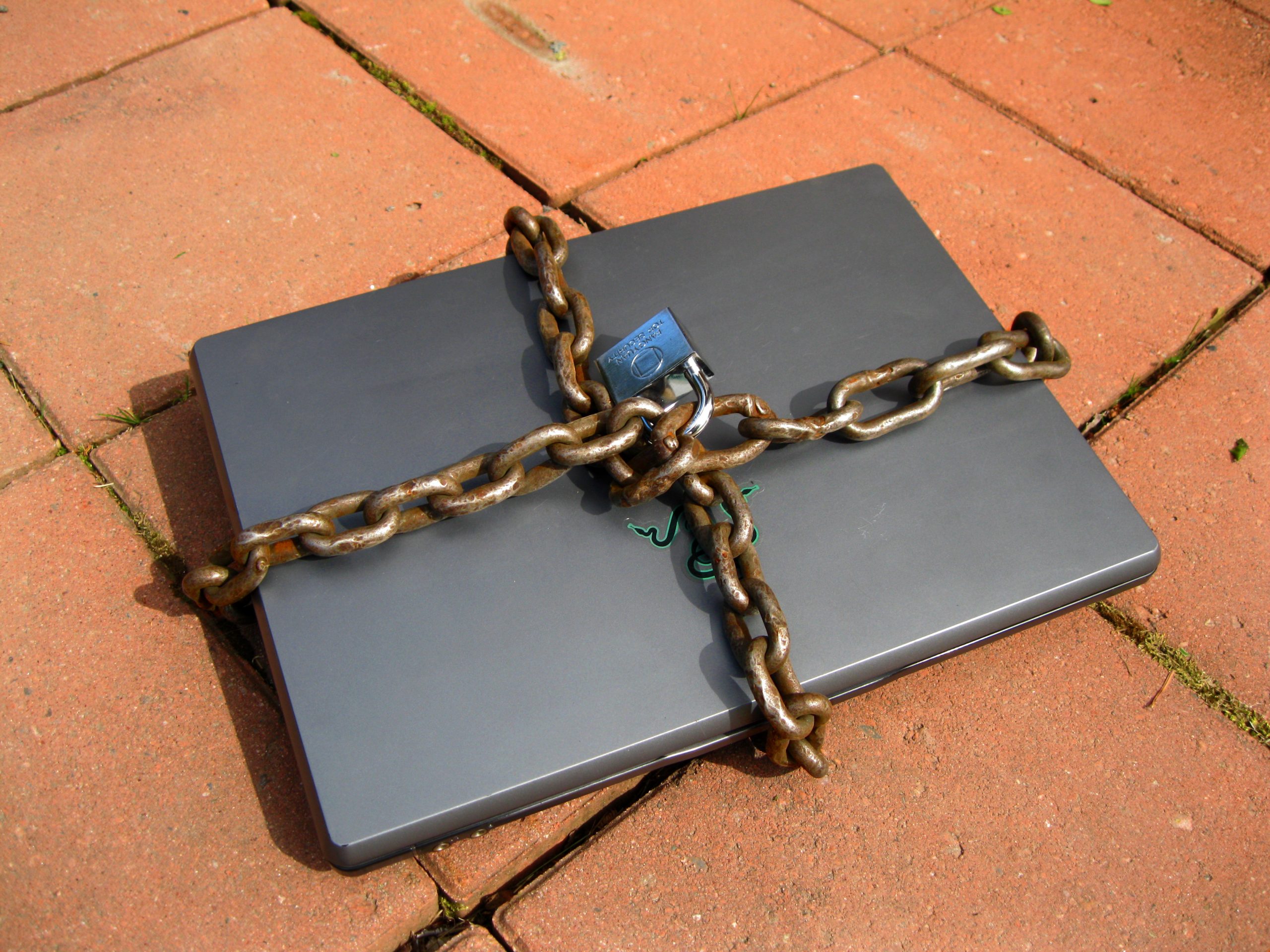 Locked laptop representing cybersecurity and operational risk in financial systems