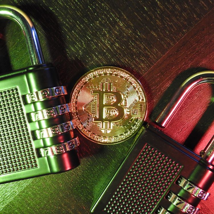 Bitcoin coin beside combination padlocks representing cryptocurrency security