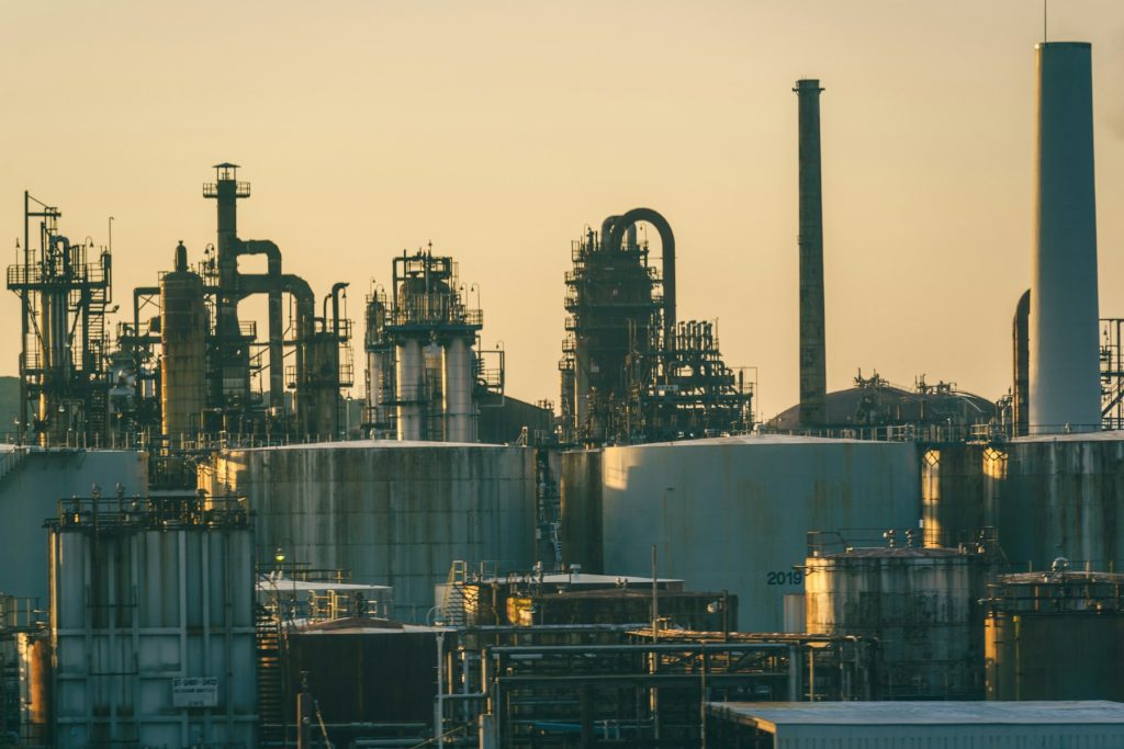 Industrial refinery and fuel storage tanks illustrating Russia diesel export restrictions and energy market risk