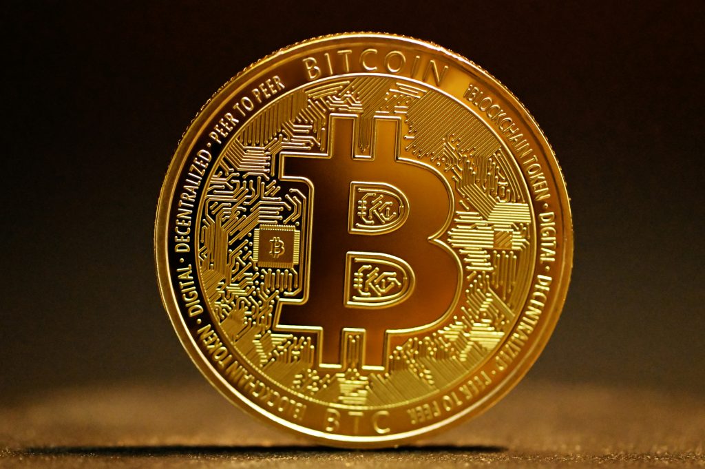 Close-up of a gold Bitcoin coin