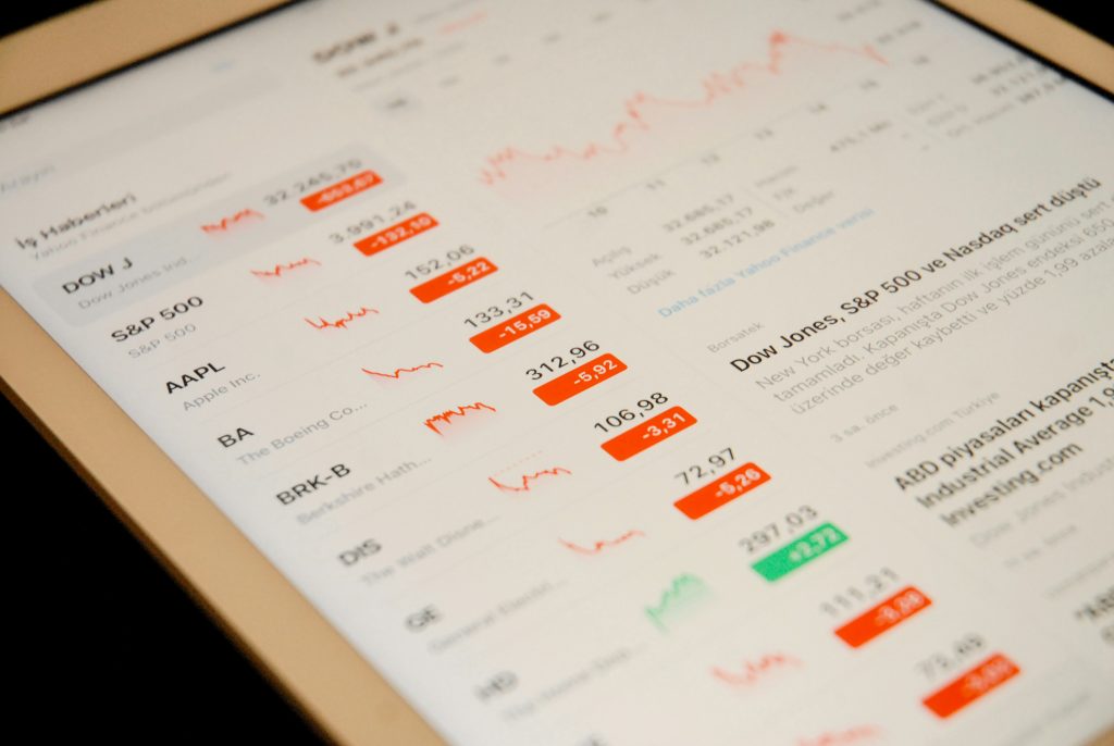 Stock market prices and financial news displayed on a tablet