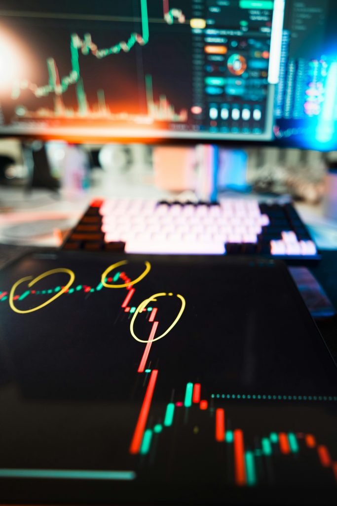 Cryptocurrency market charts displayed across digital devices