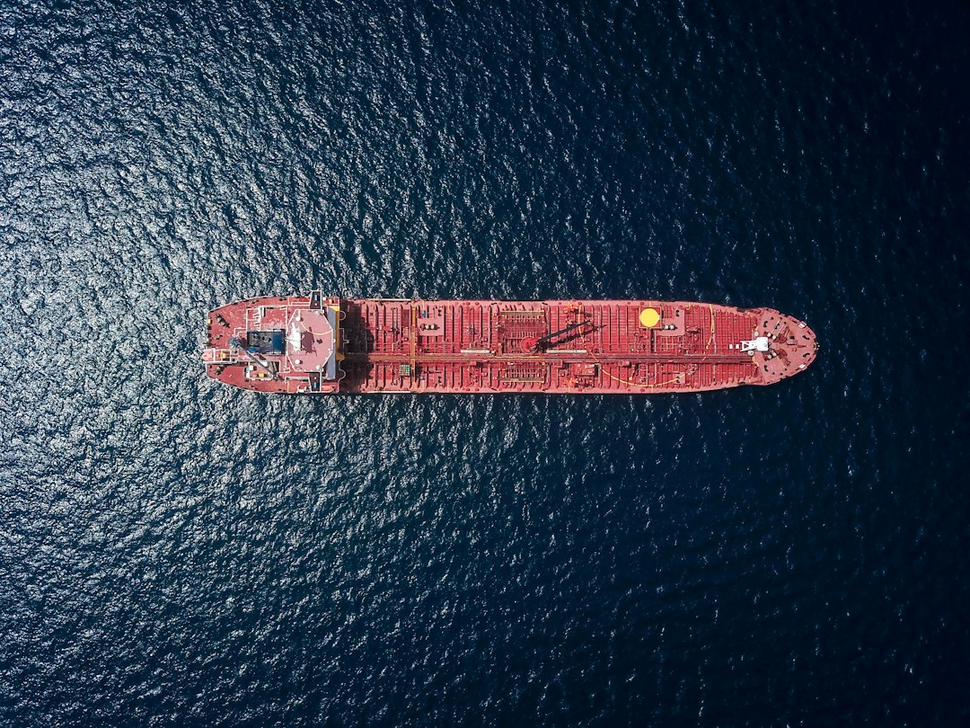 Aerial view of an oil tanker at sea illustrating crude supply and shipping markets