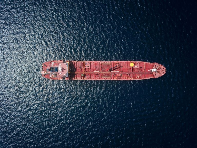 Aerial view of an oil tanker at sea illustrating crude supply and shipping markets