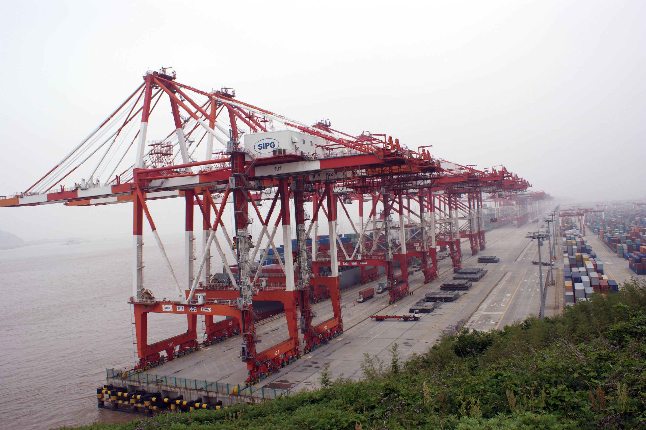 Container cranes at Yangshan Deepwater Port near Shanghai, illustrating China's August 2026 export and import surge