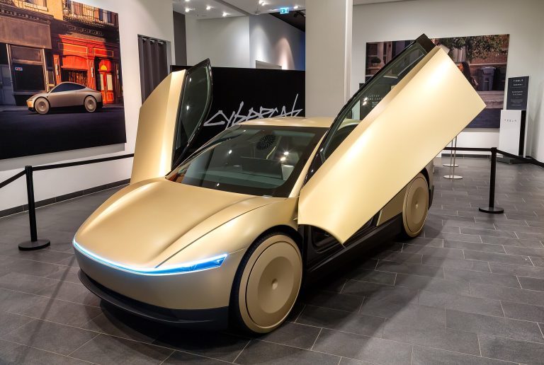 Tesla Cybercab autonomous two-seat robotaxi with butterfly doors