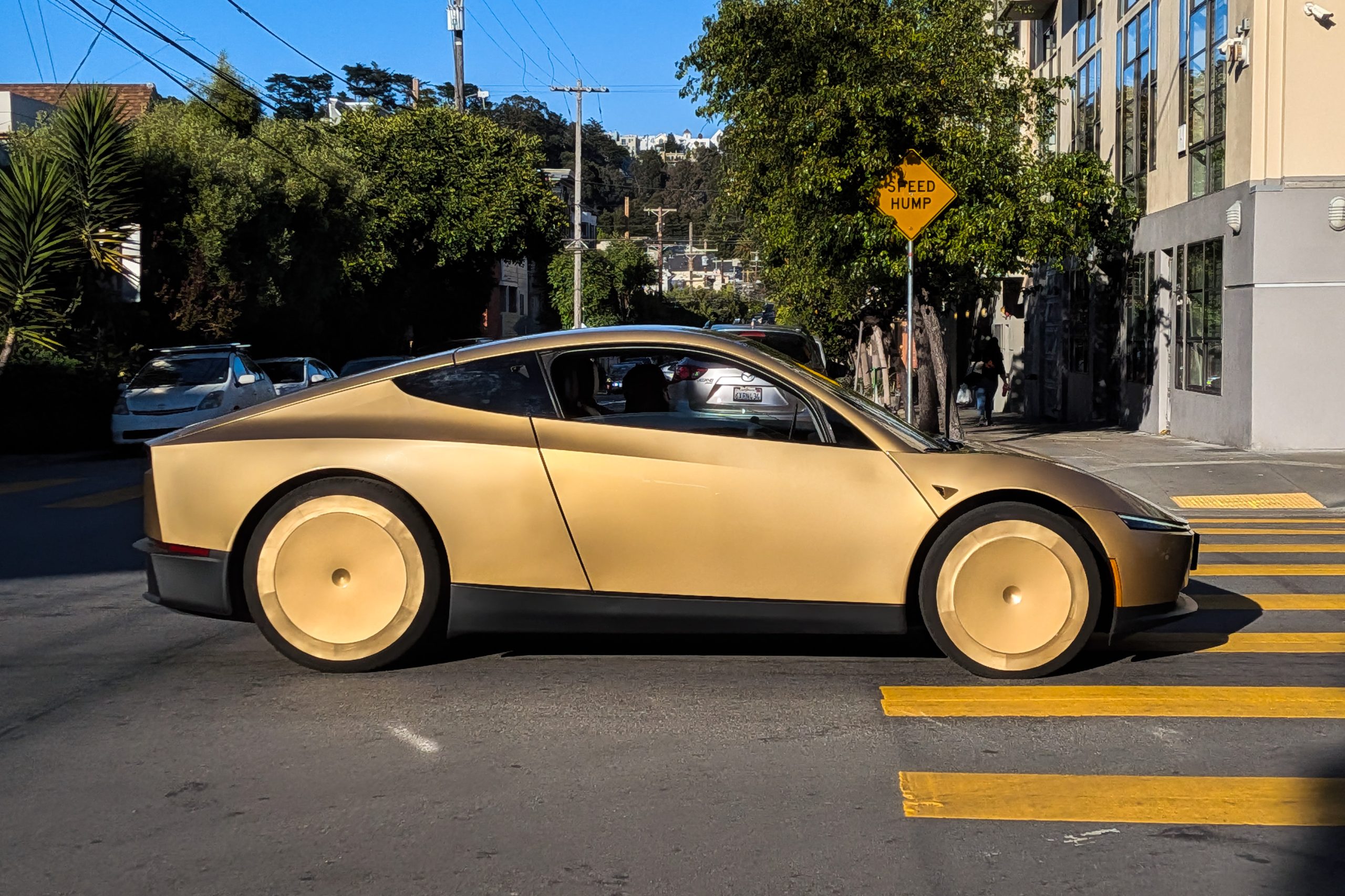 Tesla Cybercab autonomous vehicle driving on a public street