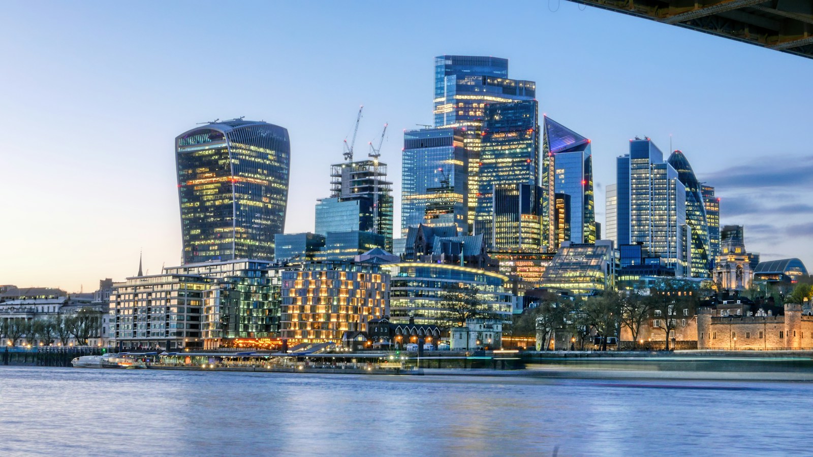 London illuminated at night, illustrating institutional finance
