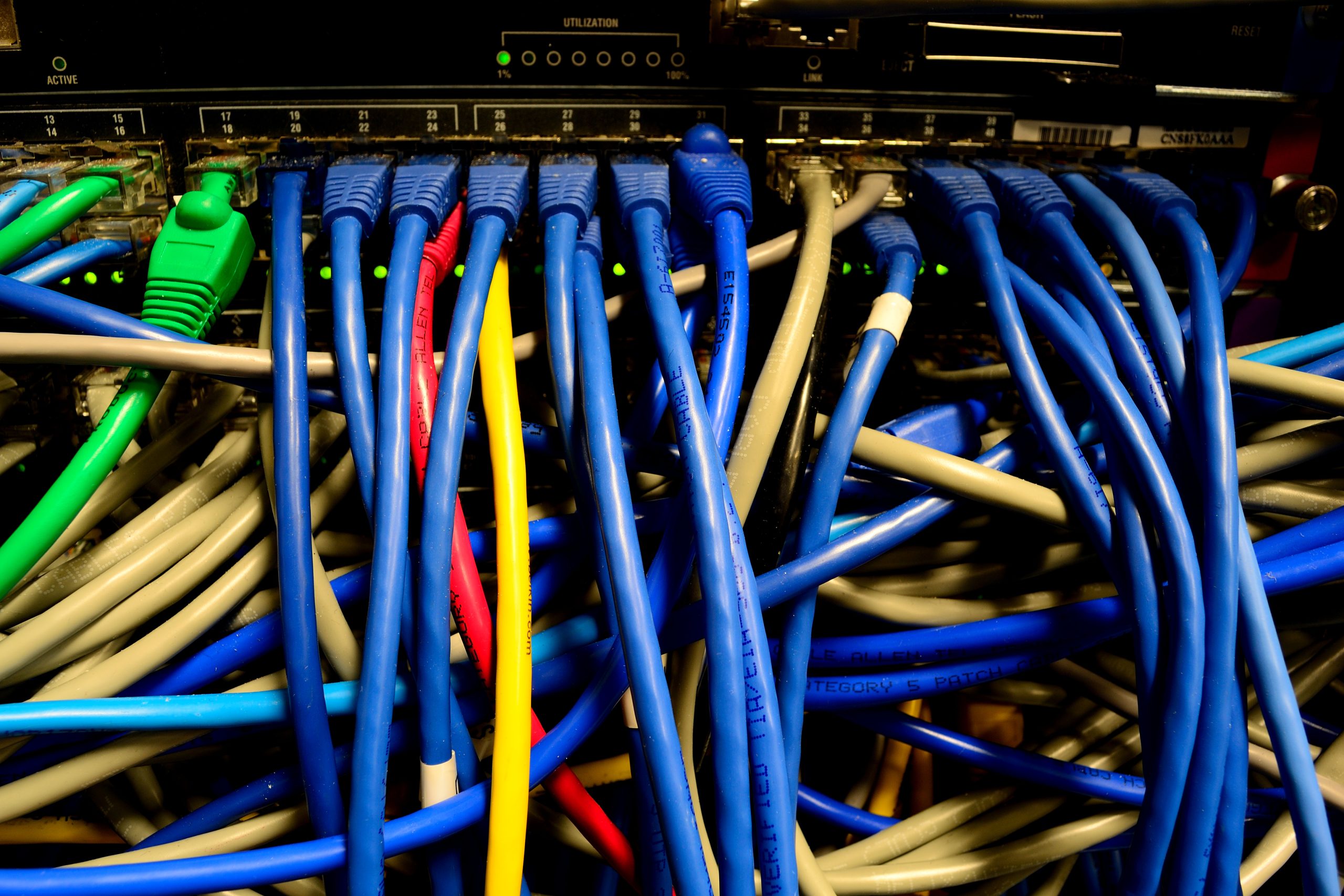 Ethernet switch and colourful network cables illustrating infrastructure connectivity